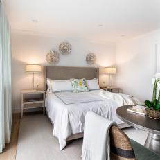 Neutral Coastal Bedroom With White Orchid