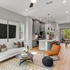 Dazzling Gray Transitional Living Room With Rustic Leather Occasional Chair