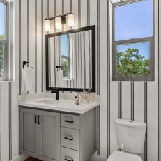 Black and White Transitional Bathroom With Sophisticated Striped Wallpaper
