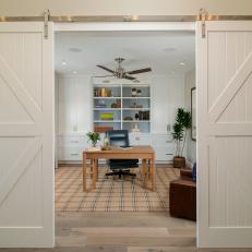 Pristine Home Office With Rustic Barnyard Doors 