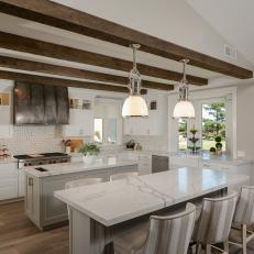Chic White Marble Kitchen Island With Rustic Range Hood 