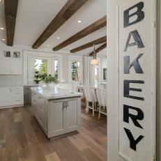 Beautiful Pearl White Kitchen With Large Homey Baking Sign