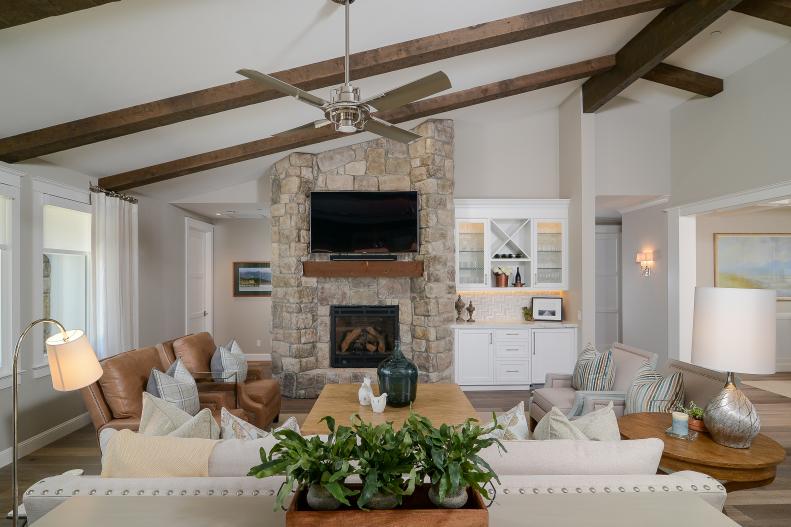 Brown Brick Fireplace With Wood Paneled Ceiling