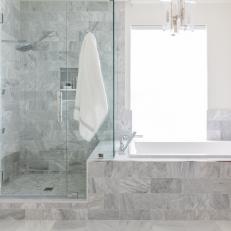 Bright Gray Tile Bathroom With Large, Roomy Bathtub