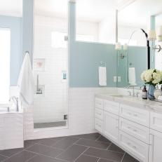 Baby Blue Bathroom With Glowing Cream Marble Countertops