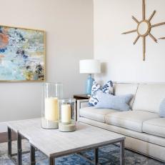 Blue Accent Living Room With Two Bronze Star Mirrors