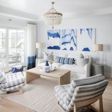 Blue and White Boho Living Room With Striped Chairs