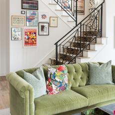 Leopard-Patterned Staircase With Eclectic Gallery Wall and Green Velvet Chesterfield