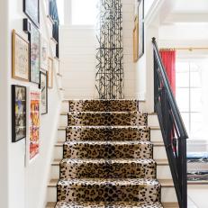 Eclectic Staircase With Colorful Gallery Wall, Iron Railing and Leopard Print Runner 