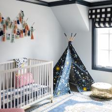 Eclectic, Contemporary Gender Neutral Nursery With Play Tepee, Crib and Antique Rug