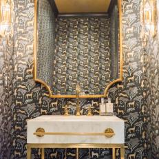 Opulent Art Deco Powder Room With Leopard Wallpaper and Gold Fixtures 