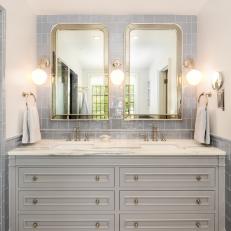 Double Vanity Bathroom With Tile Backsplash and Chrome Accents