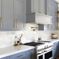 Charming Blue Kitchen With Gleaming Wolf Range