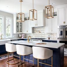 Transitional White Chef Kitchen With Navy Island