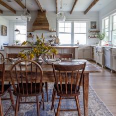Rustic Eat-In Farmhouse Kitchen With Shiplap, Reclaimed Wood, and Exposed Beams 