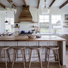 Contemporary Rustic Kitchen With Exposed Beams and Reclaimed Wood Accents 