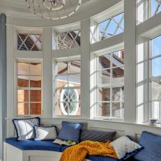 White Bay Window With Blue Upholstered Seat 