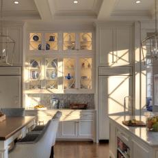 White Traditional Kitchen With Geometric Cabinetry and Chrome Pendants 