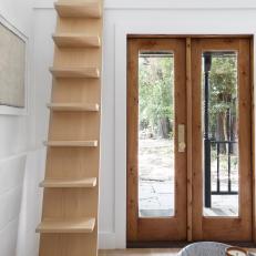Natural Plank Ladder Leads to Reading Nook in Black and White Contemporary Tiny House 