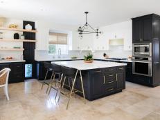 Big Marble Island, Black Cabinets, White Cabinets in Eat In Kitchen
