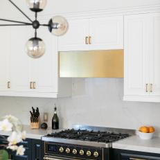 Modern Black and White Kitchen with Brass Accents