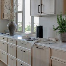 Modern Neutral Kitchen with White Countertops and Beige Cabinets 
