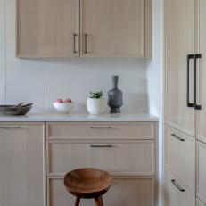 Modern White Kitchen with Neutral Wood Cabinets 