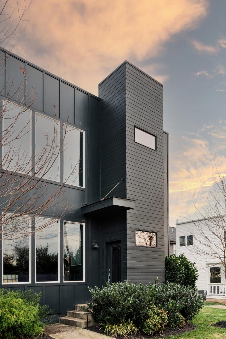 Never one to shy away from dark and dramatic tones, Chad covered the entire exterior of his Nashville home in black. Anytime you're choosing black for exterior spaces, test the samples at different times of day to make sure the hues remain consistently black. Certain undertones such as purple, brown or blue can be brought out depending on the positioning of the sun and the shade of black chosen.