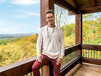 As seen on My Lottery Dream Home, host David Bromstad tours luxurious vacation homes with potential homebuyers Rick and Alicia Jultak. David on the back porch.