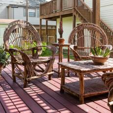 Outdoor Lounge Area Features Wicker Chairs and a Matching Table