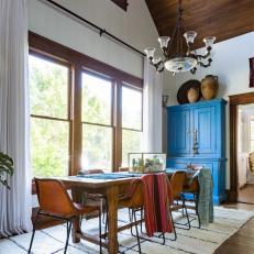 Dining Room Features Vaulted Ceilings and a Large Wood Table