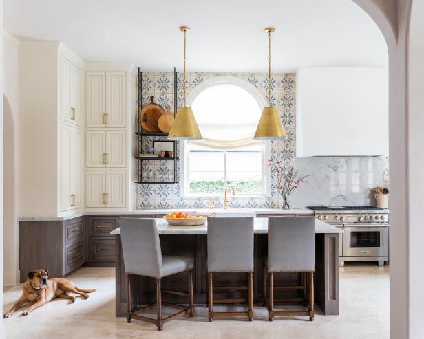 Dog Sits Beside Kitchen Island, Three Cushioned Barstools in Kitchen