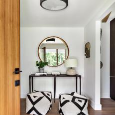 Contemporary Foyer With Black and White Stools