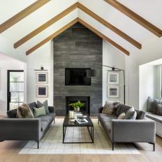 Gray Contemporary Living Room With Exposed Beams