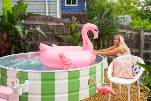 HGTV stylist Jill Tennant designed this backyard pool with a stock tank from her local co-op. Learn how to make your very own in just one weekend on HGTV.com. Flamingo pool float optional.