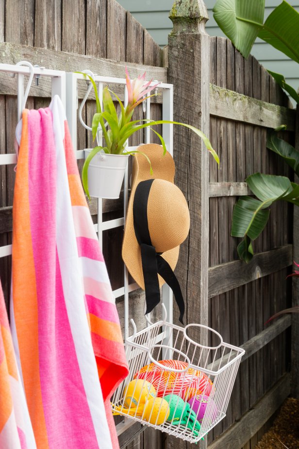 HGTV stylist Jill Tennant designed a backyard retreat with a stock tank from her local co-op, colorful cinderblock steps and a trellis for storage. Learn how to make your very own in just one weekend on HGTV.com. Flamingo pool float optional.
