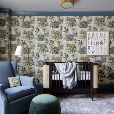 Cozy Baby Nursery With Playful Dinosaur Wallpaper