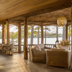 Rustic Covered Lakeside Deck With Sitting Area and Swing 