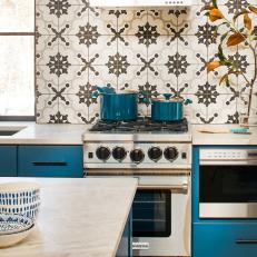 Kitchen Features Eye-Catching Backsplash and Blue Cabinets