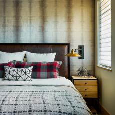 Bedroom With Dramatic Wallpaper and Wooden Ceiling Detail