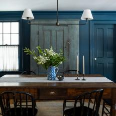 Blue Dining Room With 1900's Chairs and Custom Light Fixtures