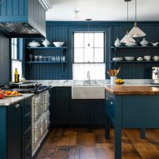 Striking Country Style Blue Kitchen With Reclaimed Wood Floors