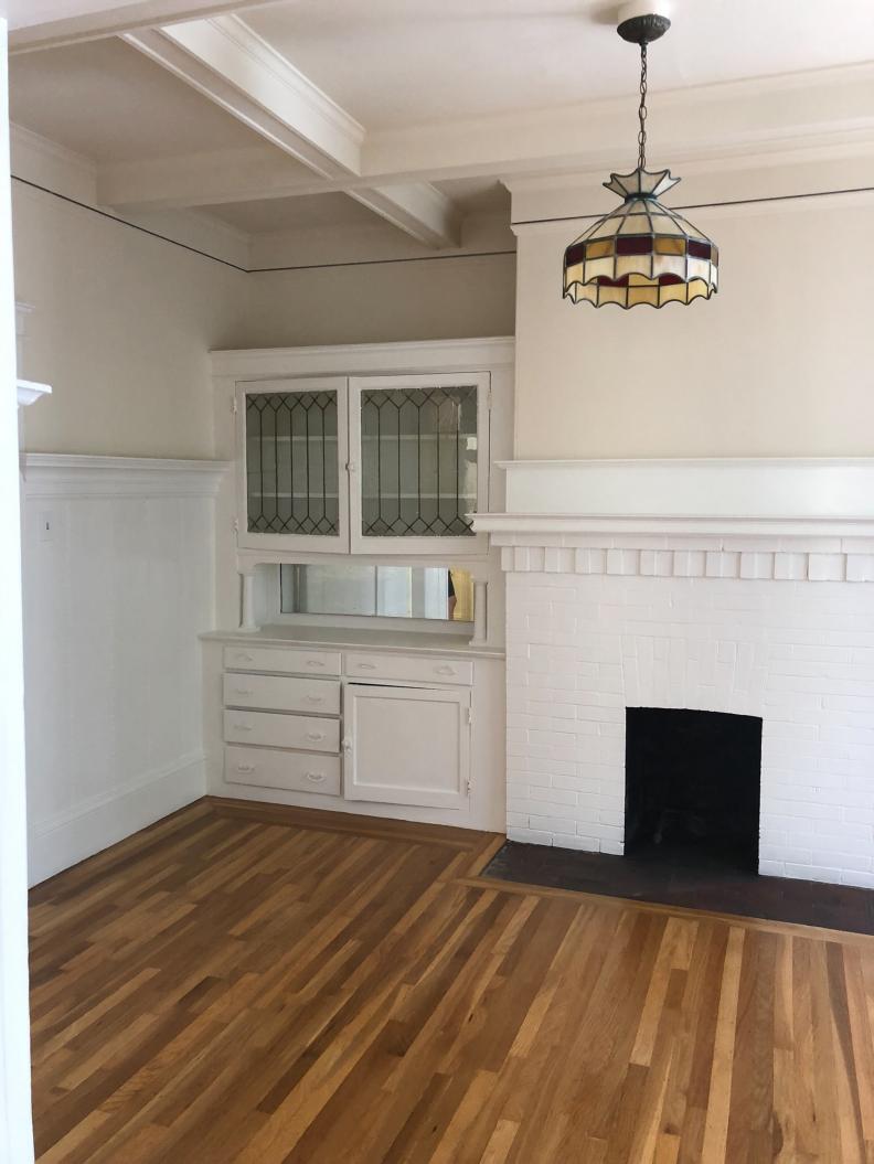 Dated Living Room With Old Style Fireplace, Pendant Light