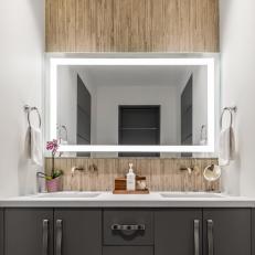 Black Bathroom Vanity and Tan Backsplash