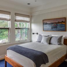 Neutral Coastal Bedroom With Blue Rug