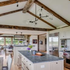 Country Open Plan Kitchen With Rustic Beams