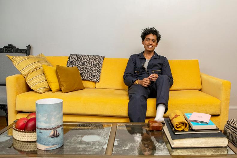 A Man Sitting On a Yellow Sofa