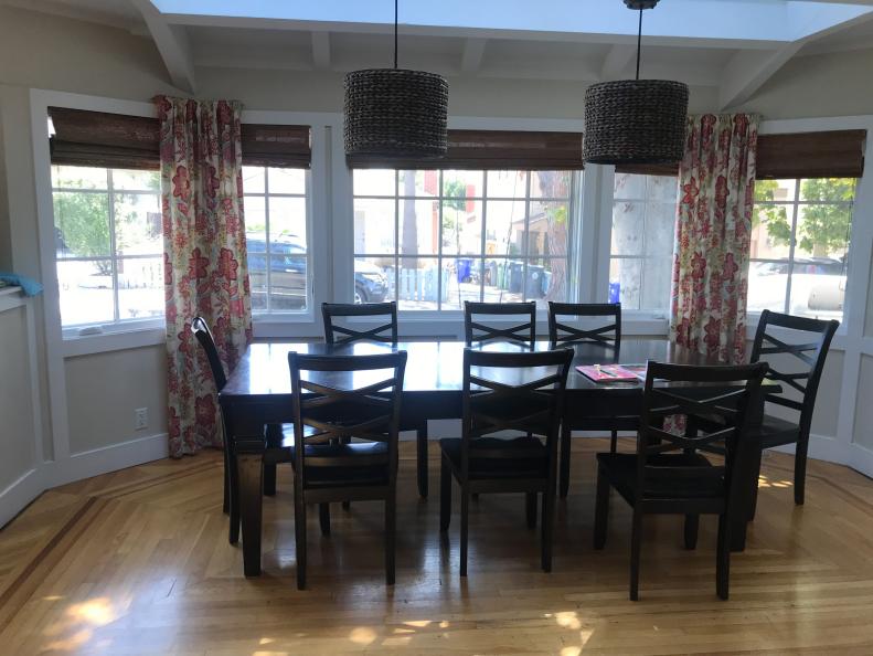 Dark Dining Room With Wall of Windows, Basic Table and Chairs