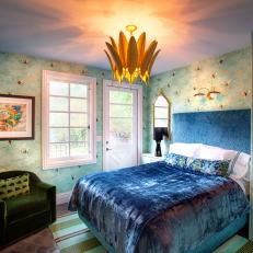 Eclectic Bedroom With Blue Velvet Bedding And Bold Green Velvet Armchair 