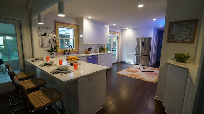Homeowners Nico and Erika Sprotti's kitchen after Show Host Mary Welch opened up the space, added more storage a sleeker, more modern design, as seen on Breaking Bland, Season 1.